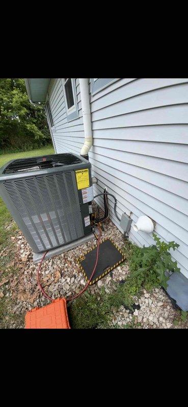 Completed full HVAC system installation including new furnace, air conditioning unit, and water heater. Exterior AC condenser unit was positioned on gravel bed against house exterior with proper clearances and mounted on concrete pad. All equipment was installed per manufacturer specifications, system tested and verified operational, with payment collected upon completion.