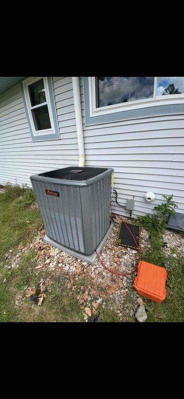 Completed full HVAC system installation including new furnace, air conditioning unit, and water heater. Exterior AC condenser unit was positioned on gravel bed against house exterior with proper clearances and mounted on concrete pad. All equipment was installed per manufacturer specifications, system tested and verified operational, with payment collected upon completion.