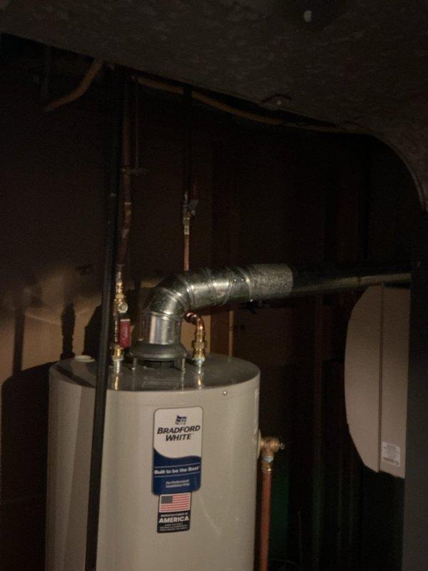 Successfully installed a 40-gallon tall natural gas Bradford White water heater in the basement utility area. The installation included proper venting through metallic ductwork, connection of copper supply lines with appropriate shut-off valves, and compliance with manufacturer specifications for clearances and safety requirements.