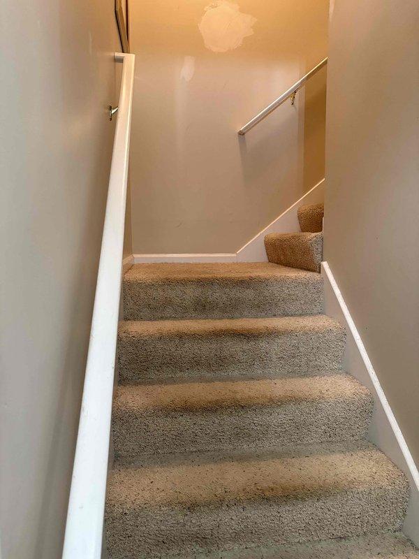 Conducted water heater estimate for residential property requiring replacement of large floor-mounted tank unit. Assessed existing installation location in basement area with exposed joists, documented current plumbing configuration including metallic supply lines and PVC drainage systems, and photographed infrastructure conditions to prepare replacement specifications. Confirmed customer contact information for scheduling future installation work.