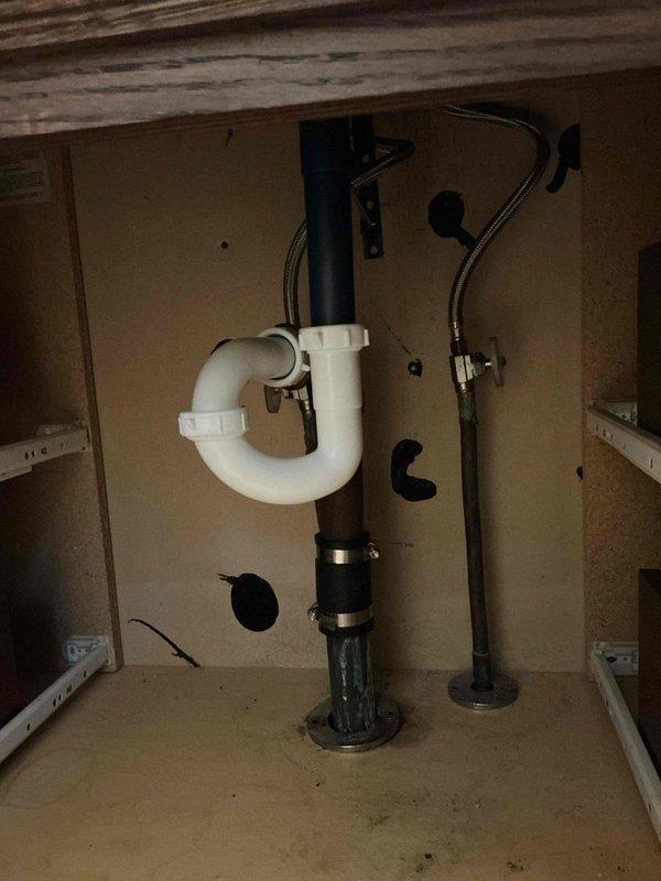 Completed shower valve and faucet replacement in residential bathroom. Replaced existing tub/shower valve assembly with new fixtures, including installation of chrome tub spout, diverter valve, and shower head with flexible metal hose. Flushed water lines to clear sediment and discolored water from system following valve replacement. Under-sink plumbing inspected and confirmed proper operation of supply lines and shut-off valves.