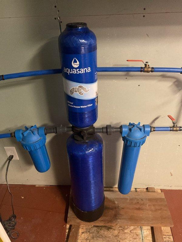 Performed routine inspection of Aquasana Rhino whole house water filtration system following recent well installation. Inspected complete system including main filter tanks, pre-filters, post-filters, PEX piping connections, and brass ball valves for proper operation and potential issues. All components found in excellent working condition with no leaks, pressure irregularities, or filter maintenance requirements identified at this time.