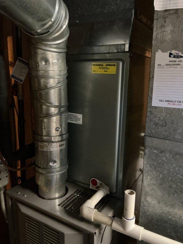 # ASTU-AC Super Tune-up Completed

Performed comprehensive super tune-up service on a 16-year-old Rheem HVAC system located in basement utility area. Conducted thorough inspection of air handler unit, ductwork connections, and condensate drainage system with PVC piping and red-handled valves, verifying all components operational and system running efficiently.