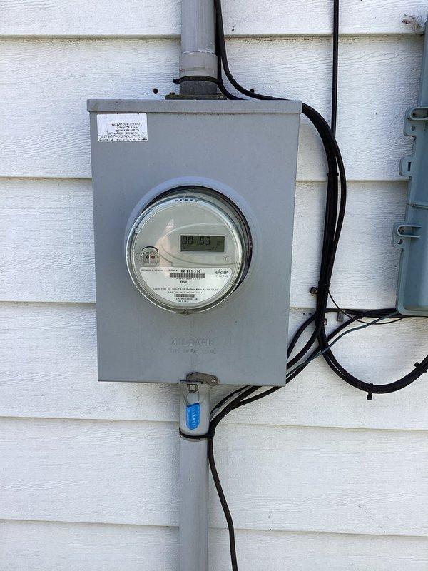 Conducted electrical assessment for panel upgrade required prior to air conditioning installation. Evaluated existing exterior electrical service, meter enclosure, and main service entrance conductors. Documented current electrical infrastructure including meter box configuration, conduit routing, and service capacity to determine specifications for panel upgrade necessary to support new HVAC system load requirements.