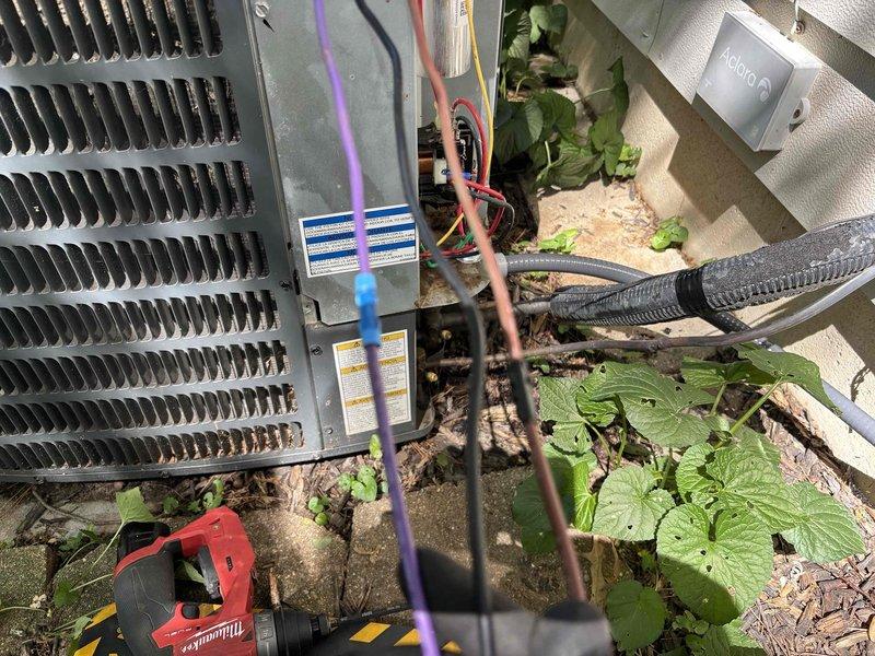 # CP-Cooling Problem

Responded to no cooling complaint on 6-year-old residential air conditioning system. Upon inspection, discovered extensive corrosion on electrical connection bracket and mounting components within outdoor condensing unit. Heavy rust deterioration was affecting electrical terminals and wire connections, compromising system operation and creating potential safety hazards. Cleaned corroded electrical connections, secured all wire terminations, and verified proper system operation. Unit restored to normal cooling function with temperature setpoint achieved.
