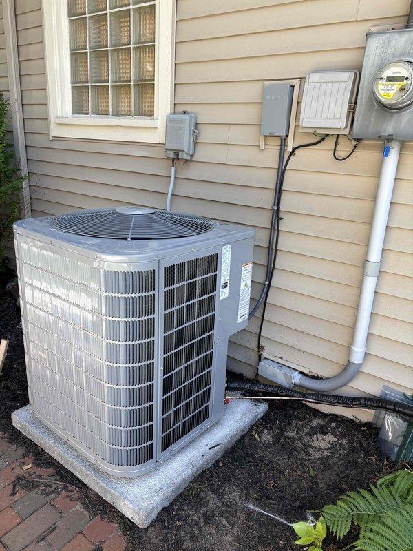 Completed full HVAC system installation including new furnace and air conditioning unit. Interior furnace installed in mechanical room with proper ductwork connections, venting, and condensate drainage, mounted on protective pad per code requirements. Exterior AC condenser unit positioned on concrete pad with electrical disconnect, refrigerant lines connected and charged, and all electrical connections completed to meter and breaker panel. System tested and verified operational with proper airflow, temperature differential, and safety controls functioning as specified.