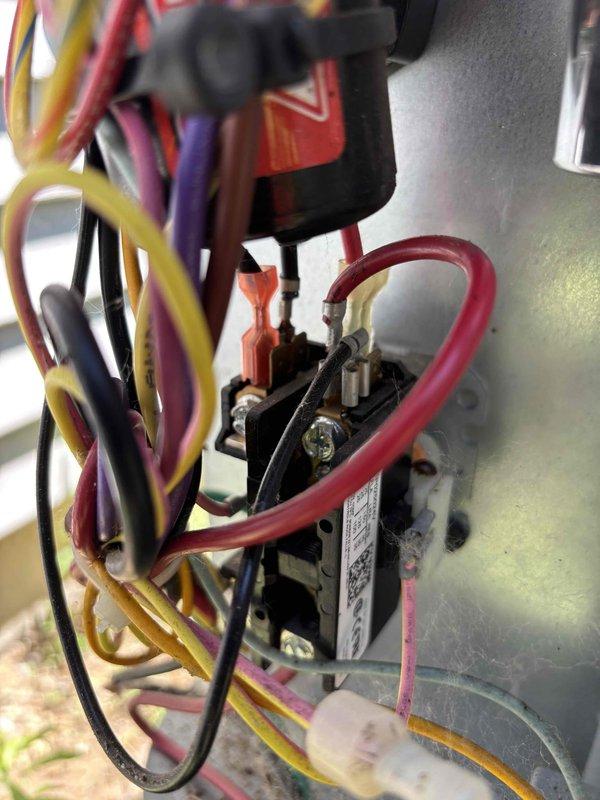 Completed annual cooling maintenance on residential air conditioning system with limited access constraints. Performed comprehensive tune-up including inspection of electrical components, contactor assembly, CoreSense diagnostics module for Copeland scroll compressor, and capacitor testing (verified 5.18 μF rating). Replaced air filter per customer request, checked all low-voltage control circuit connections and wiring integrity, and documented system condition with photos of electrical panel assembly and control components.
