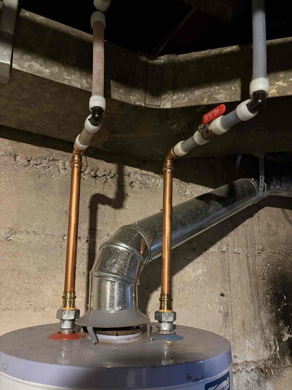 Provided estimate for replacement of 16-year-old Kenmore water heater in basement utility area. Inspected existing unit with copper supply piping, brass compression fittings, and ball valve shutoff, documenting current installation configuration and basement conditions. Customer seeking competitive pricing after receiving previous estimate from another contractor.