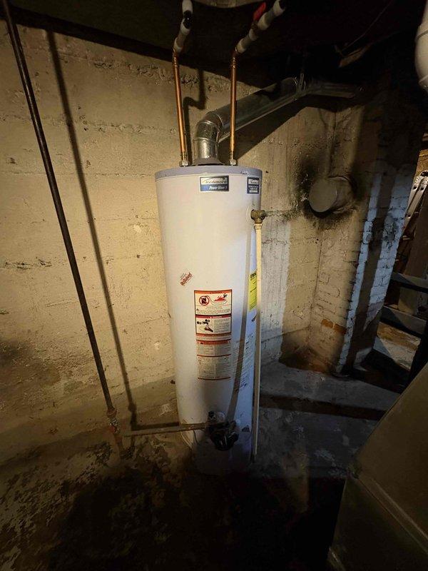 Provided estimate for replacement of 16-year-old Kenmore water heater in basement utility area. Inspected existing unit with copper supply piping, brass compression fittings, and ball valve shutoff, documenting current installation configuration and basement conditions. Customer seeking competitive pricing after receiving previous estimate from another contractor.