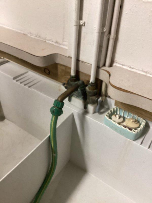 Completed plumbing project estimate for faucet replacement and additional plumbing repairs. Assessed utility sink installation with aging copper supply lines, brass compression fittings, and shut-off valves requiring attention. Documented existing HVAC equipment connections and plumbing infrastructure in mechanical room area, including PVC to copper pipe transitions and associated fixtures requiring service.