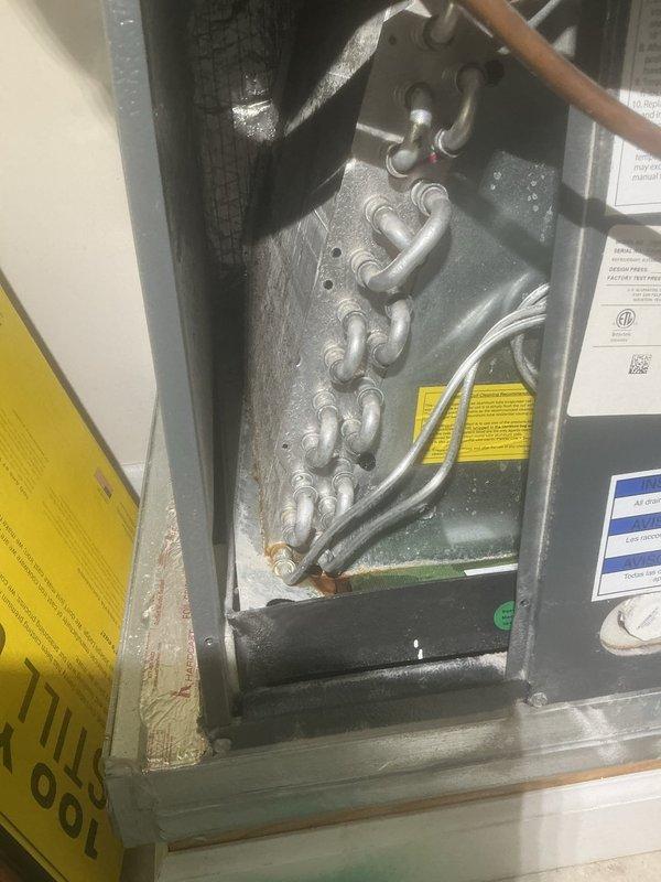 Performed refrigerant leak search on HVAC system and added UV dye to refrigerant circuit for future leak detection. Inspected evaporator coil assembly, heat exchanger components, and refrigerant line connections throughout the unit. System will require follow-up inspection to identify any leak locations once dye has circulated through the refrigerant system.