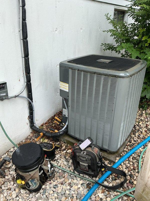 Completed annual cooling maintenance on residential air conditioning system under active maintenance agreement. Performed comprehensive tune-up including inspection of indoor air handler unit with Aprilaire humidification system and outdoor condenser unit. Checked refrigerant pressures and system operation, cleaned condenser coils, verified electrical connections at disconnect box, and tested overall system performance. Unit operating within normal parameters. All maintenance tasks completed successfully with no issues identified requiring immediate attention.