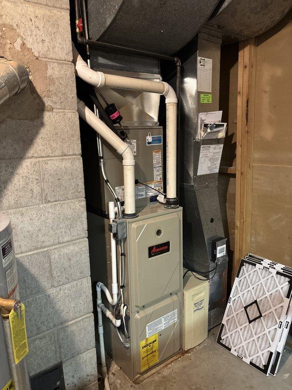 Completed full HVAC system replacement including outdoor condensing unit and indoor Amana furnace. Installed new refrigerant lines with proper insulation, electrical disconnect box, and connected all refrigerant piping with brass fittings. Established complete ductwork connections, PVC venting system, and verified all electrical connections to code. System tested and operational upon completion.