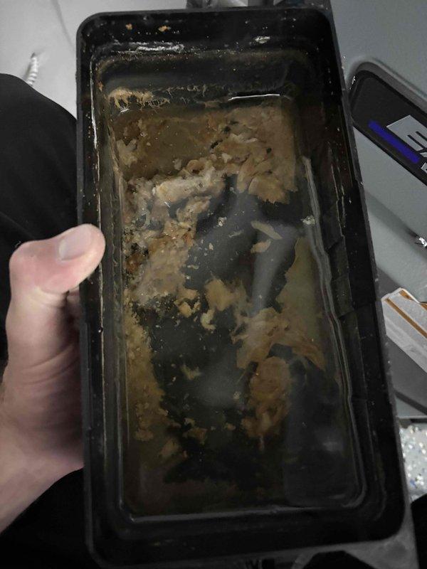 Completed annual cooling maintenance service on EnergiAir system under 5-year warranty coverage. Performed comprehensive inspection of condensate drain pan and housing, which showed significant accumulation of debris and biological growth requiring cleaning. Removed and cleaned drain pan to prevent potential overflow and water damage. Inspected internal components, drain lines, and mechanical systems for proper operation and clearance.