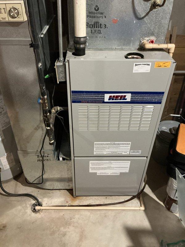 Conducted comprehensive assessment of existing Heil brand furnace and air conditioning system in residential basement mechanical room. Customer reported AC operational but furnace not functioning properly. Performed detailed inspection of furnace unit, including examination of manufacturer labels, ventilation systems, electrical connections, and PVC vent piping. Documented current equipment condition and configuration, noting all mechanical connections, ductwork, and utility interfaces. Provided estimate for furnace and AC replacement options based on system evaluation and customer needs.