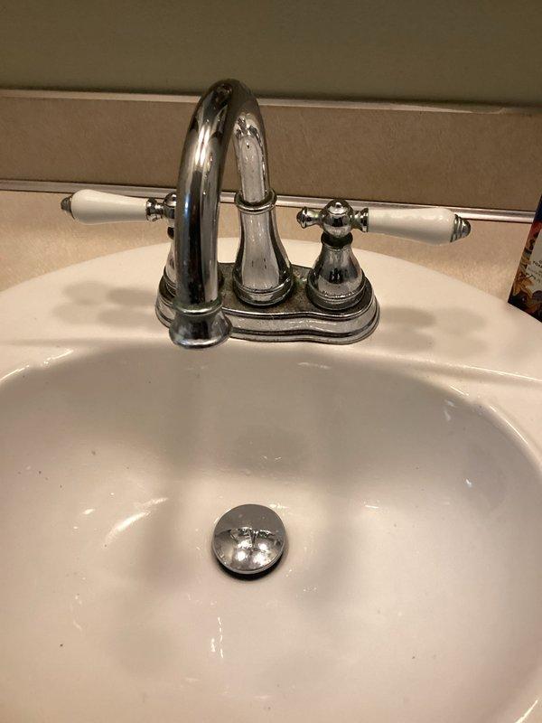Completed routine Plumbing Club Inspection of residential bathroom fixtures. Documented bathroom sink with chrome center-set faucet, pop-up drain assembly, and toilet installation, confirming all fixtures are in proper working condition with no visible leaks or defects noted.