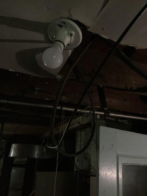 Responded to electrical service call for residence with stolen wiring that rendered property uninhabitable. Conducted comprehensive assessment of electrical system and documented extensive wire theft damage throughout the structure. Inspected basement utility area and mechanical room, examining compromised electrical infrastructure including missing conductors from HVAC equipment, heating systems, and main distribution points. Photographed affected areas showing exposed equipment, damaged wiring connections, and vacant conduit runs where copper conductors had been removed. Documented conditions for insurance claim purposes, capturing evidence of theft-related electrical system damage that would require complete rewiring to restore power and habitability to the residence.