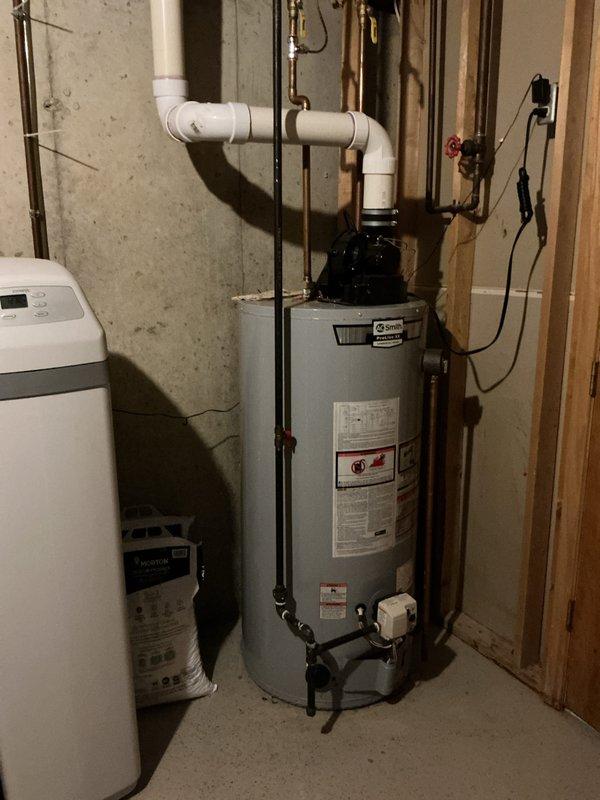 Responded to gas leak complaint with reported rotten egg odor near back door exterior. Performed comprehensive leak detection survey of gas piping system, with particular attention to areas where piping was previously rerouted in April. Inspected all accessible gas lines, connections, and fittings throughout basement utility area including furnace supply lines and water heater connections. Utilized combustible gas detector to identify leak source at compromised fitting on gas line. Isolated affected section, tightened connection, and performed soap bubble test to verify repair integrity. Conducted final system pressure test and confirmed all gas appliances operating safely with no detectable leaks present. Documented equipment conditions and piping configurations with photographs for service records.