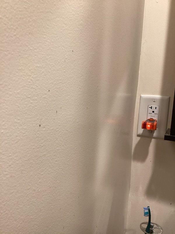 Responded to urgent service call for multiple areas without power in 63-year-old home, affecting both bathrooms, thermostat, and Wi-Fi system since overnight. Upon arrival, tested malfunctioning GFCI outlet and confirmed open ground condition reading 122V with outlet tester. Identified failed GFCI receptacle as source of circuit interruption affecting all downstream devices on shared breaker circuit. Replaced defective GFCI outlet, restored proper grounding, verified correct voltage and protection functionality, and confirmed power restoration to all affected areas including bathrooms, thermostat, and network equipment.
