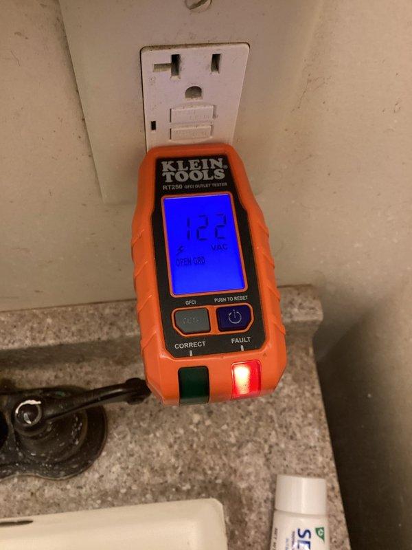 Responded to urgent service call for multiple areas without power in 63-year-old home, affecting both bathrooms, thermostat, and Wi-Fi system since overnight. Upon arrival, tested malfunctioning GFCI outlet and confirmed open ground condition reading 122V with outlet tester. Identified failed GFCI receptacle as source of circuit interruption affecting all downstream devices on shared breaker circuit. Replaced defective GFCI outlet, restored proper grounding, verified correct voltage and protection functionality, and confirmed power restoration to all affected areas including bathrooms, thermostat, and network equipment.