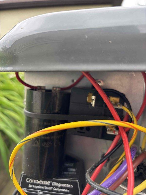 Completed annual cooling maintenance on EnergiAir system under 2-year warranty coverage. Performed comprehensive AC tune-up including inspection of electrical components, capacitor, compressor with CoreSense diagnostics module, and refrigerant lines. All wiring connections, control modules, and mechanical components inspected and found to be operating within normal parameters with no immediate service needs identified.