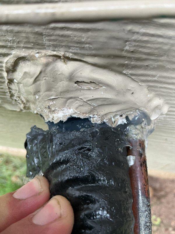 Completed annual AC tune-up on 11-year-old EnergiAir system with 2017 condenser model. During inspection, discovered severe ice buildup on refrigerant line indicating low refrigerant charge or restricted airflow. Documented ice accumulation on copper suction line with photographic evidence. Verified outdoor condenser unit operational with proper clearances and secure mounting on concrete pad. System requires follow-up for refrigerant leak detection and charging, as ice formation on suction line confirms inadequate cooling capacity and potential compressor damage risk if left unaddressed.
