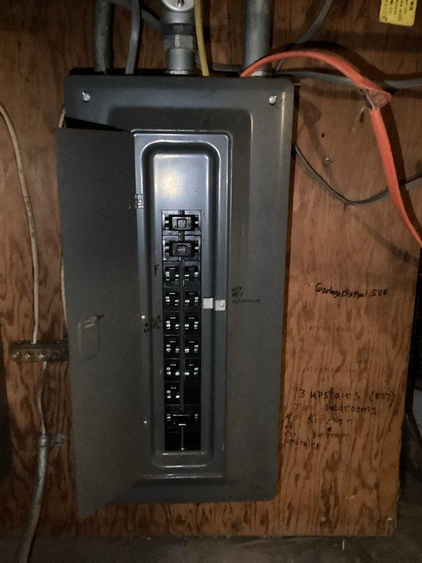 Conducted electrical estimate for new electrical line installation in residential property. Documented existing electrical panel configurations in basement and attic locations, photographing current circuit breaker arrangements, conduit routing, and wire management systems to assess scope of work required for additional electrical service lines. Identified panel capacities, available breaker slots, and optimal pathways for new circuit installation through unfinished utility spaces.