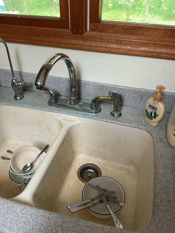 Conducted on-site assessment of five faucets requiring replacement estimates, including kitchen and bathroom fixtures. Documented existing conditions of kitchen faucet with spray attachment and dual bathroom vanity faucets with lever handles, capturing detailed photos for replacement recommendations and customer review.