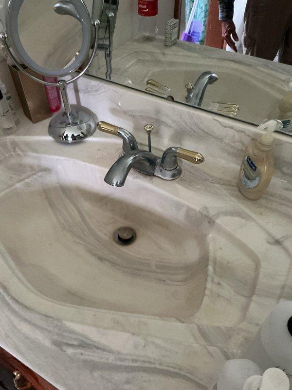 Conducted on-site assessment of five faucets requiring replacement estimates, including kitchen and bathroom fixtures. Documented existing conditions of kitchen faucet with spray attachment and dual bathroom vanity faucets with lever handles, capturing detailed photos for replacement recommendations and customer review.