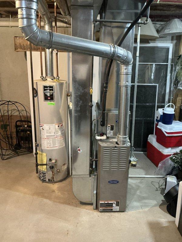 Conducted comprehensive evaluation of existing HVAC system and water heater in residential condominium for replacement estimate. Assessed 17-18 year old Carrier furnace, aging water heater, and outdoor air conditioning condenser unit, documenting current equipment conditions, configurations, and installation specifications including ductwork connections, venting systems, and electrical service to provide accurate replacement recommendations for all three systems.