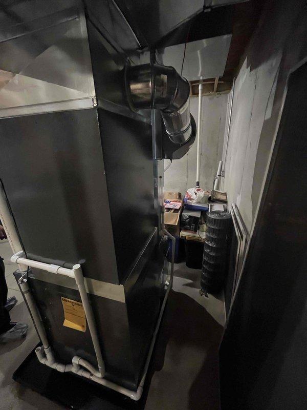 Completed full HVAC system replacement in residential basement utility room. Removed existing equipment and installed new furnace unit with proper venting configuration using white PVC piping for condensate drainage and combustion air intake. Connected metal ductwork and plenum to air handler, ensuring proper airflow distribution throughout the home. Positioned equipment on protective mat over concrete floor with appropriate clearances for service access. Routed all venting, drainage lines, and flexible ductwork per manufacturer specifications and local building codes. Verified all connections are secure, labeled equipment appropriately with safety and specification tags, and confirmed system operates within normal parameters. Installation completed as same-day service with financing arrangements processed.