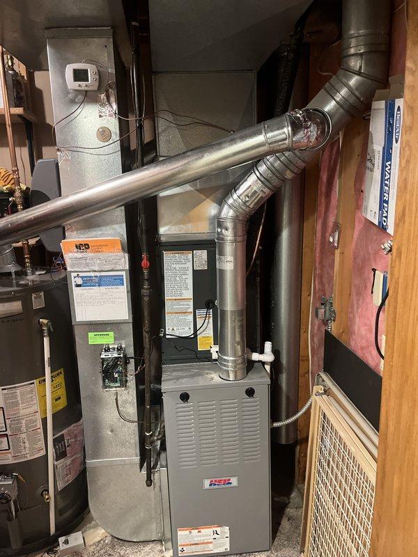 Completed full air conditioning system replacement including outdoor condenser unit and indoor air handler components. New condenser installed on existing concrete pad with proper refrigerant line connections, electrical conduit routing through exterior wall, and secure mounting to manufacturer specifications. Indoor HVAC equipment integrated with existing ductwork system, ensuring proper airflow distribution and system compatibility. All connections tested, system charged, and operational verification performed to confirm cooling capacity and efficient operation.