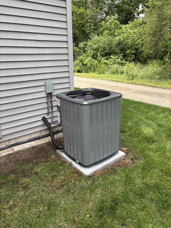 Completed full residential air conditioning system replacement. Removed existing outdoor condensing unit and installed new high-efficiency AC condenser on prepared concrete pad with proper clearances from structure. Ran new refrigerant lines and electrical conduit to exterior wall, installed disconnect box, and made all necessary electrical connections per manufacturer specifications. Verified proper system operation, refrigerant charge, and airflow upon startup.