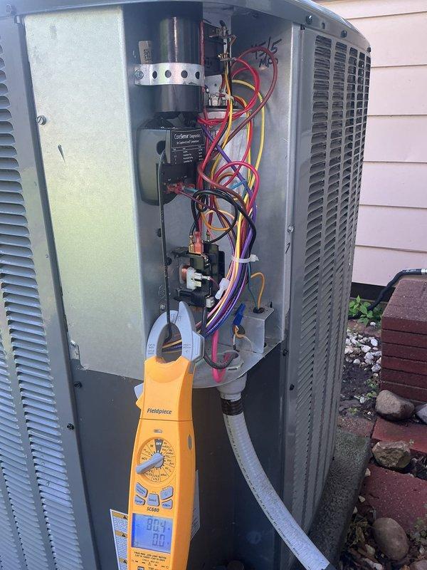 Completed annual cooling maintenance on EnergiAir system installed in 2023. Performed comprehensive inspection of outdoor condenser unit, removed access panel to evaluate electrical components including capacitor, contactors, and wiring connections. Utilized Fieldpiece diagnostic meter to measure system performance parameters and verify proper operation. Inspected refrigerant lines, cleaned condenser coil, and confirmed unit is operating within manufacturer specifications for the upcoming cooling season.