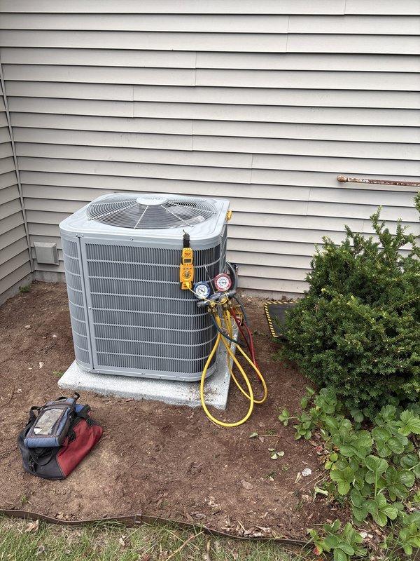 Completed full installation of new residential furnace and air conditioning system. Installed outdoor condensing unit on concrete pad with proper refrigerant charging and pressure testing using manifold gauges to verify system performance. Installed new furnace unit in basement mechanical room with appropriate venting and gas connections, ensuring all equipment is properly positioned and operational alongside existing water heater.