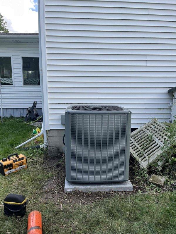 Completed full HVAC system replacement including outdoor condensing unit and indoor air handling equipment. Removed existing system and installed new air conditioning condenser on concrete pad at exterior of residence with proper refrigerant line connections and electrical hookup. Installed new indoor air handler and furnace assembly in basement utility area with ductwork integration, condensate drainage via PVC piping, and electrical connections. Verified proper system operation, refrigerant charge, airflow, and all safety controls. All equipment secured, labeled, and tested for optimal performance.