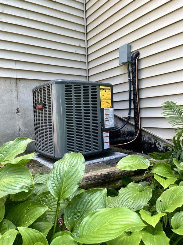 Completed full HVAC system replacement including indoor furnace unit and outdoor condensing unit. Installed new furnace in basement utility area with proper venting and ductwork connections, positioned adjacent to existing water heater. Mounted new outdoor condensing unit on concrete pad at exterior corner of residence, installed refrigerant line set with appropriate insulation, secured electrical disconnect box to siding, and completed all refrigerant connections between indoor and outdoor components. System tested and verified operational upon completion.