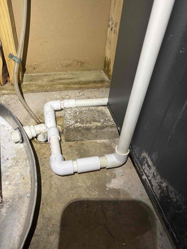Completed annual cooling maintenance visit on EnergiAir system under active warranty coverage through 2029. Performed comprehensive inspection of outdoor condenser unit, noting significant dirt and debris accumulation on louver vents and horizontal slat surfaces requiring cleaning attention. Inspected indoor components including basement installation area with PVC drainage system and associated plumbing connections, verifying proper operation and drainage functionality. System operational at time of service completion.