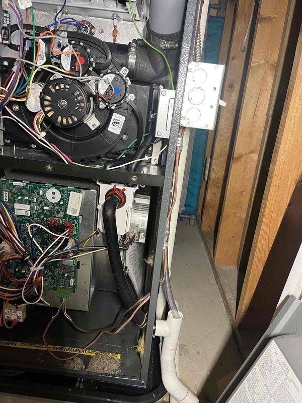Completed annual cooling maintenance on 2011 Carrier AC system with warranty through June 2026. Performed comprehensive tune-up including inspection of blower motor assembly, control board, electrical connections, and refrigerant lines. Removed debris accumulation from base platform and verified all components operating within normal parameters. All colored wire connections secure, condensate drain line clear and functioning properly, and system tested successfully upon completion.