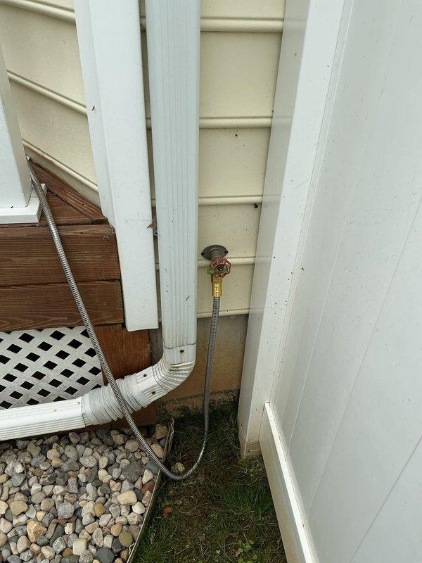 Replaced two exterior hose bibs with frost-proof spigots to eliminate an existing leak and prevent future freeze damage. The 25-year-old home had standard wall-mounted faucets that were susceptible to freezing, with one unit experiencing a long-term leak issue. Removed the old spigots, installed new frost-proof models with extended valve stems that shut off water inside the heated space, and tested both units for proper operation and drainage.