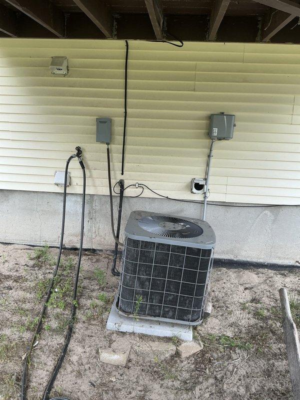 Completed full HVAC system replacement estimate for 27-year-old International Comfort Products system with non-functional central air conditioning due to refrigerant leak. Assessed existing furnace and AC unit serving entire house, documented current equipment configuration including indoor air handler with ductwork connections and outdoor condenser unit, and provided replacement options with financing information through Michigan Saves program.
