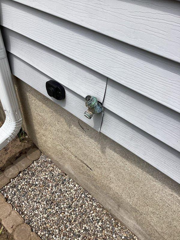 Conducted on-site assessment for replacement of aging exterior hose bibs. Inspected existing outdoor spigot installations and evaluated supply line connections from basement water heater area. Documented current plumbing configuration including copper piping routing and foundation penetration points. Photographed exterior wall-mounted fixtures and interior water distribution system to provide comprehensive estimate for hose bib replacement project.