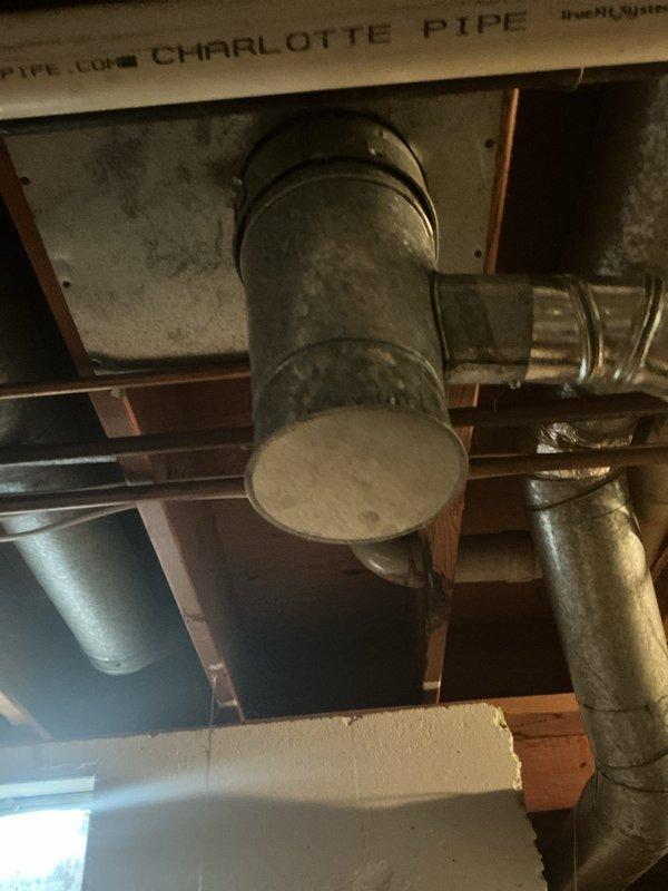 Responded to emergency call for leaking water heater in residential basement. Upon arrival, inspected 15-year-old water heater and identified active leak requiring immediate attention. Documented existing plumbing configuration including copper supply lines, pressure relief valve, and connection points to assess replacement requirements and ensure proper system integration with existing HVAC infrastructure.