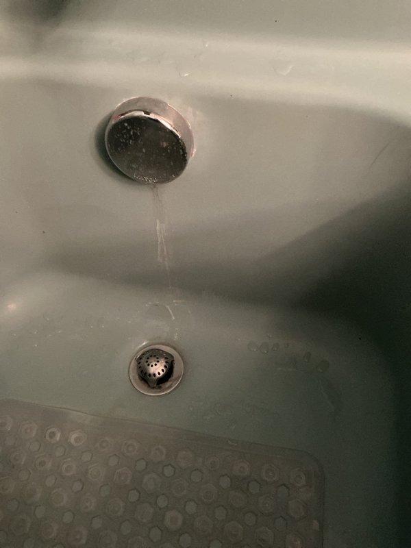 Conducted on-site assessment for shower fixture replacement in residential bathroom. Evaluated existing chrome shower control valve, tub spout, and drainage system for compatibility with proposed new shower head and handle assembly. Documented current plumbing configuration including wall-mounted fixtures and verified water supply connections to provide accurate project estimate for fixture upgrade.