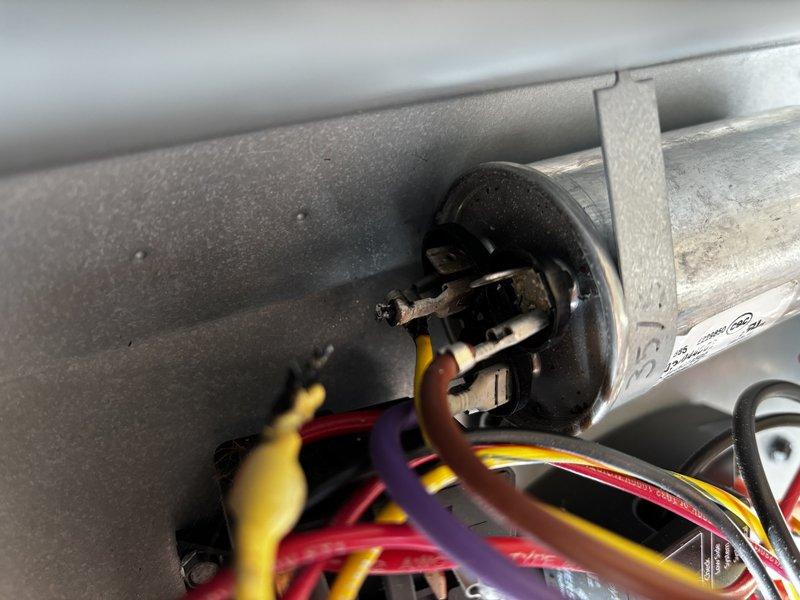 Responded to air conditioning system not cooling to setpoint. Upon inspection, found failed dual run capacitor preventing compressor and condenser fan motor from operating properly. Replaced defective capacitor with manufacturer-approved component, verified proper microfarad ratings, and tested system operation. Unit now cooling effectively with all electrical connections secure and components functioning within normal parameters.