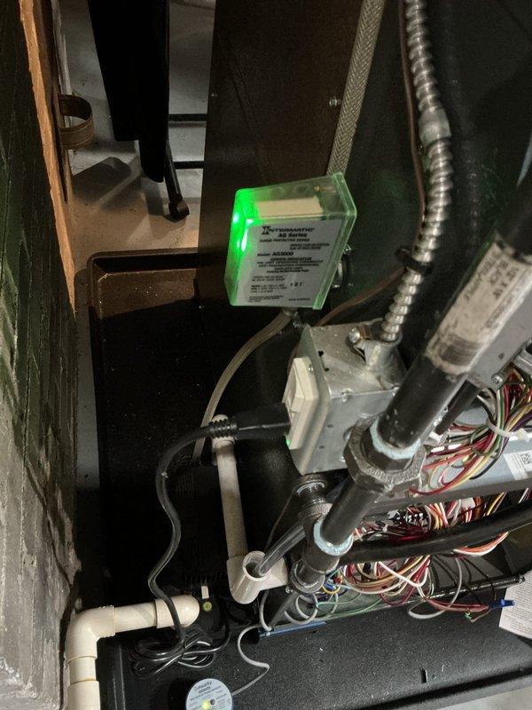 Returned to complete QUOTR-quoted repair work on HVAC system. Successfully replaced failed ECM blower motor with new unit, ensuring proper electrical connections and secure mounting within the air handler assembly. Installed Intermatic surge protector device to protect system electronics from voltage spikes and power fluctuations. Verified all wire terminations at control board, confirmed proper motor operation across all speed settings, and tested system functionality. Unit operating normally with improved electrical protection in place.