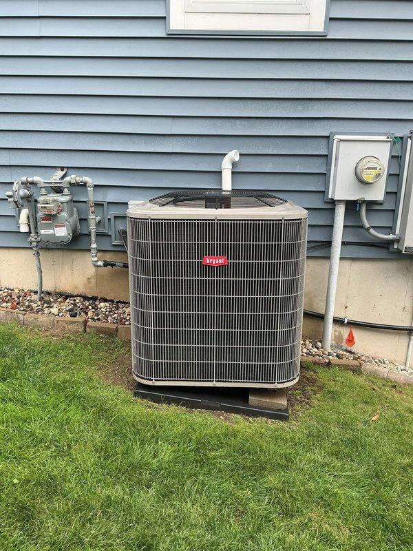 Completed annual cooling maintenance on 11-year-old residential air conditioning system. Performed comprehensive inspection of outdoor condenser unit, verified proper operation of all electrical components and connections, checked refrigerant levels and pressures within manufacturer specifications, cleaned condenser coils, inspected condensate drain line and PVC piping for proper drainage, and confirmed unit cycling and performance meet operational standards.