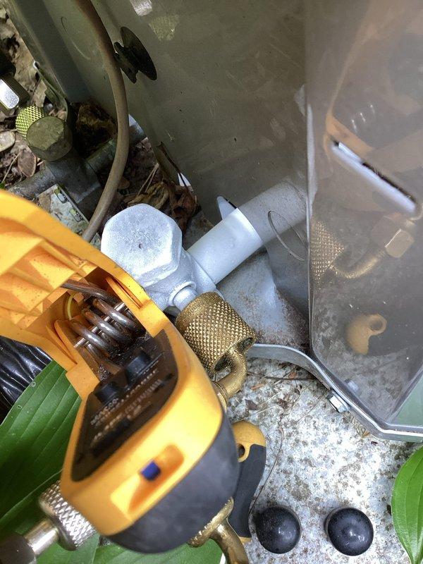 Completed annual cooling maintenance on 2021 Carrier unit. Inspected system components and identified significant organic debris accumulation in drain pan including leaves, twigs, and decomposed plant matter. Cleaned and cleared all debris from drain pan and compartment to prevent drainage blockage and ensure proper condensate removal. Verified electrical connections, inspected refrigerant lines, and confirmed all wiring and copper tubing routing. Tested system operation and drainage functionality following cleaning procedures.