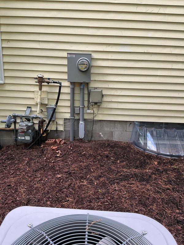 Completed comprehensive Electrical Club Inspection for 2021 construction. Documented exterior utility installation including meter base, service entrance conduit, and associated electrical components mounted on residential siding. Inspected and photographed interior main electrical panel with digital monitoring system, verified proper circuit breaker arrangement and labeling, and documented auxiliary electrical components including surge protection devices and control systems mounted on exposed framing in utility area.