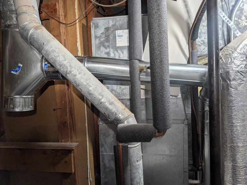 Completed exhaust flue replacement on residential HVAC system. Removed existing deteriorated vent piping and installed new stainless steel segmented flue pipe with proper elbow configuration to ensure safe venting of combustion gases. Verified all connections are secure, properly sealed, and meet code requirements. System tested and operating safely with adequate draft and no exhaust leaks detected.